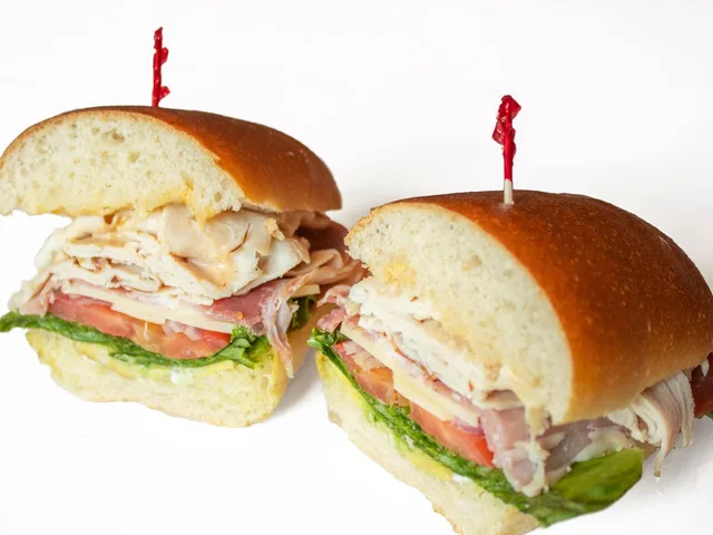Beach Boy sandwich with turkey, prosciutto, Swiss and avocado, halved