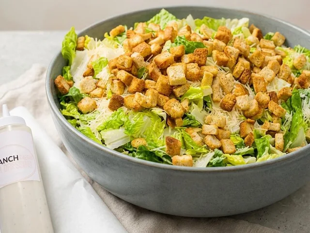 Caesar salad with croutons and parmesan cheese