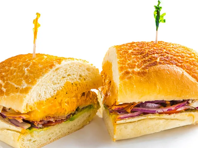 Chicken Chipotle sandwich with pepper jack and avocado, halved