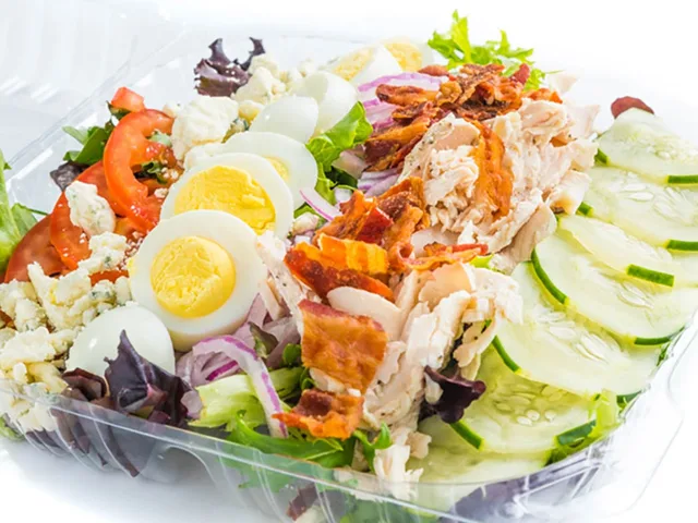 Cobb salad with chicken, bacon and hardboiled egg