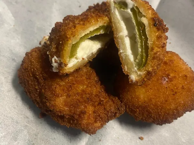 Jalapeño poppers stuffed with cream cheese, cut open