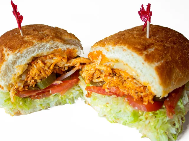 Spicy Chicken sandwich with fire pepper sauce and pepper jack, halved
