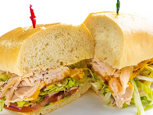The California sandwich with turkey, bacon, cheddar and avocado, halved