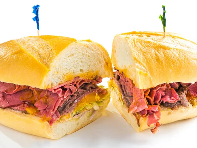 The Slammer sandwich with pastrami, roast beef, salami and cheddar, halved
