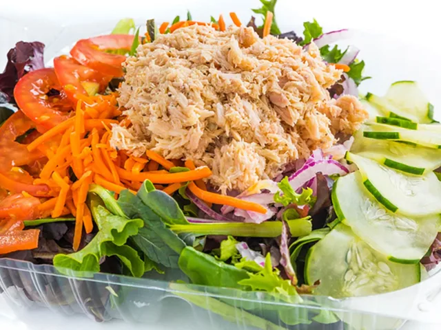 Tuna Nicoise salad with hardboiled egg on mixed greens